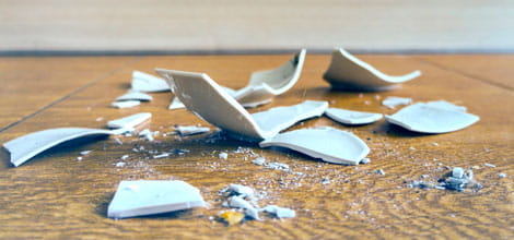 Close up of broken china on floor